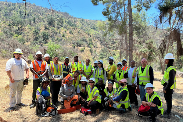 Jaquan (top row, second from left) pictured with 24 members of the 2020 Bobcat Fire restoration crew in the central San Gabriel Mountains, part of the Angeles National Forest