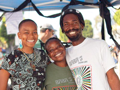 Wo'se Kofi (far right) owner of Baba's Vegan Cafe in South L.A.