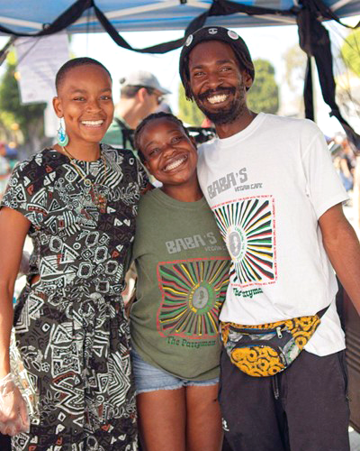 Wo'se Kofi (far right) owner of Baba's Vegan Cafe in South L.A.