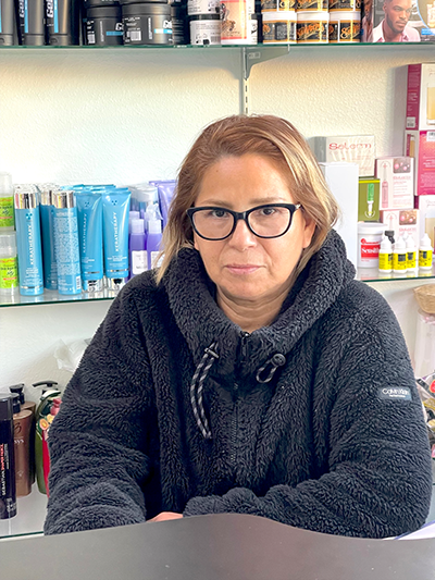 Olga Gomez, owner of Daisy’s Beauty Salon in South Los Angeles