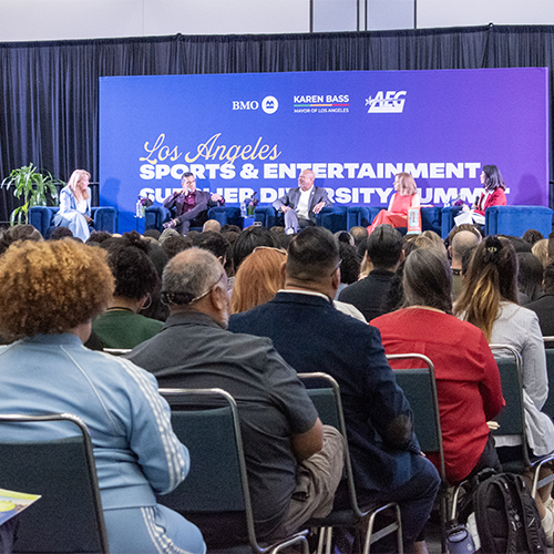 a seated crowd listens to a panel about the ProcureLA program at the 2024 Sports and Entertainment Supplier Diversity Summit