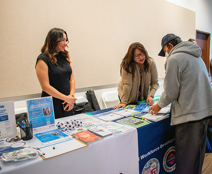 a Silicosis awareness information table with literature for workers and businesses