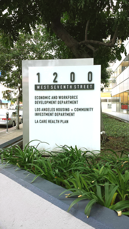 EWDD west facing street sign with address, 1200 West 7th Street, Los Angeles
