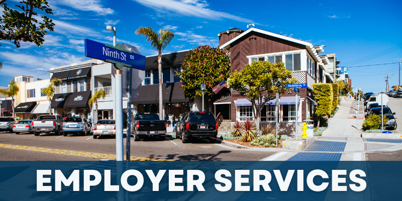 EWDD Employment Services; pictured block of retail shops along Manhattan Ave at Ninth Street