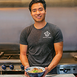 Kenshi Kobayashi holds a Tonkotsu Ramen bowl, one of the premium meal kits from his company, Kenchan Ramen which specializes in authentic and chef crafted DIY Ramen kits for home cooks
